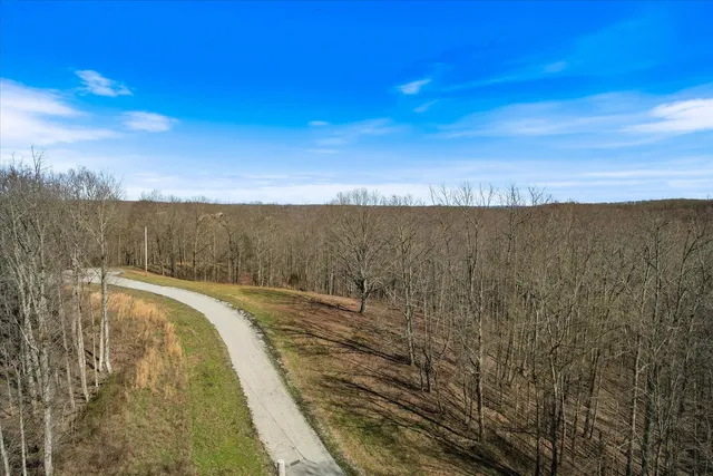 a view of wooden space next to a building