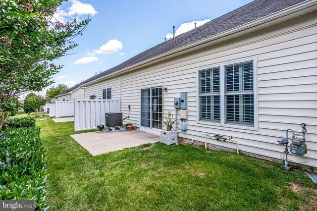 a backyard of a house with seating space