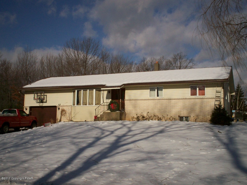 1111 Griffin Road Moscow, PA 18444 - Photo 1 of 8 a view of a house with a yard
