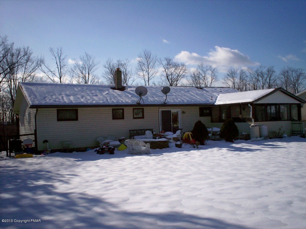 1111 Griffin Road Moscow, PA 18444 - Photo 2 of 8 a view of a house with a yard and sitting area
