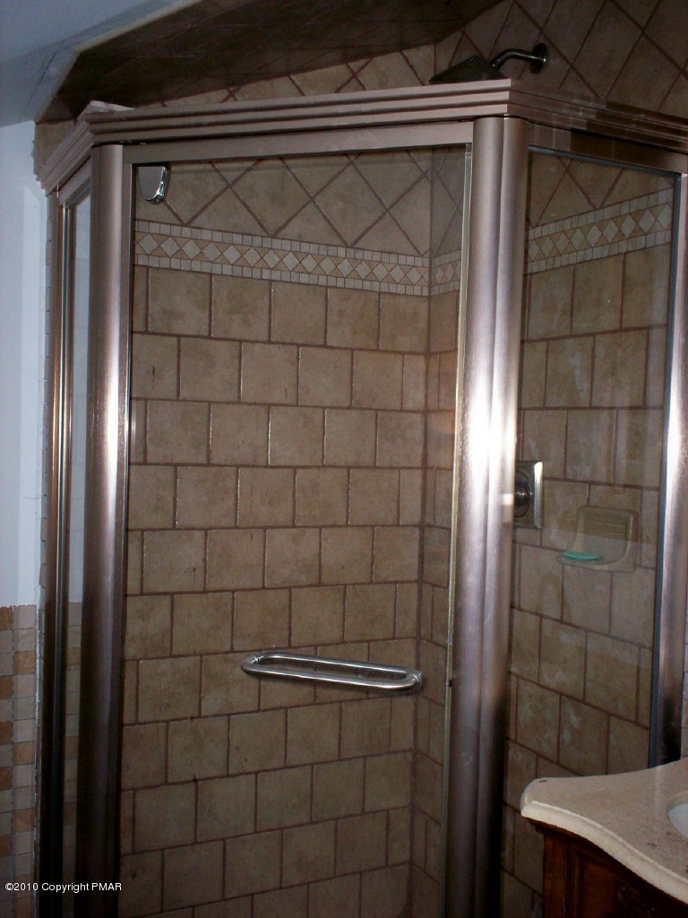 1111 Griffin Road Moscow, PA 18444 - Photo 5 of 8 a bathroom with a shower and a sink