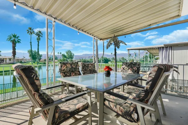 a view of an outdoor dining space with furniture