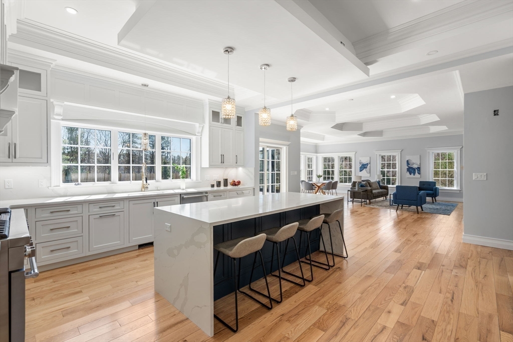 10 Hitching Post Lane Weston, MA 02493 - Photo 12 of 42 a kitchen with sink cabinets and wooden floor
