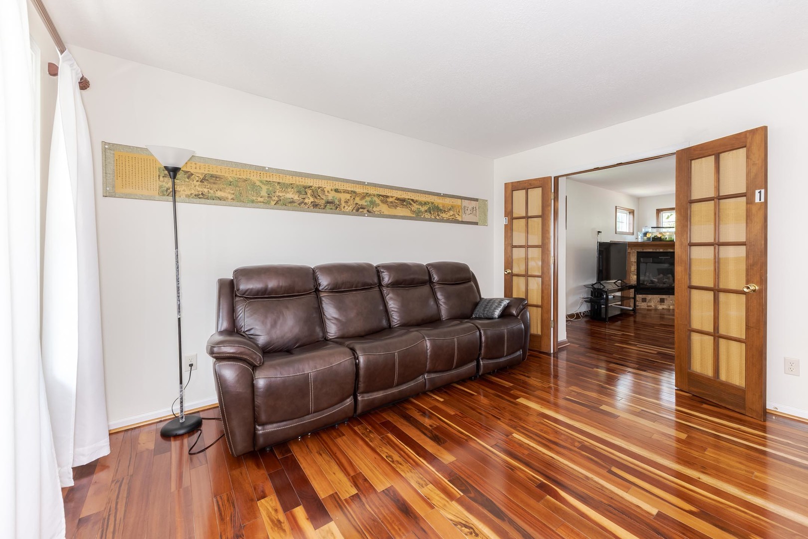3250 Topaz Road Normal, IL 61761 - Photo 11 of 54 a living room with a couch and a coffee table with wooden floor