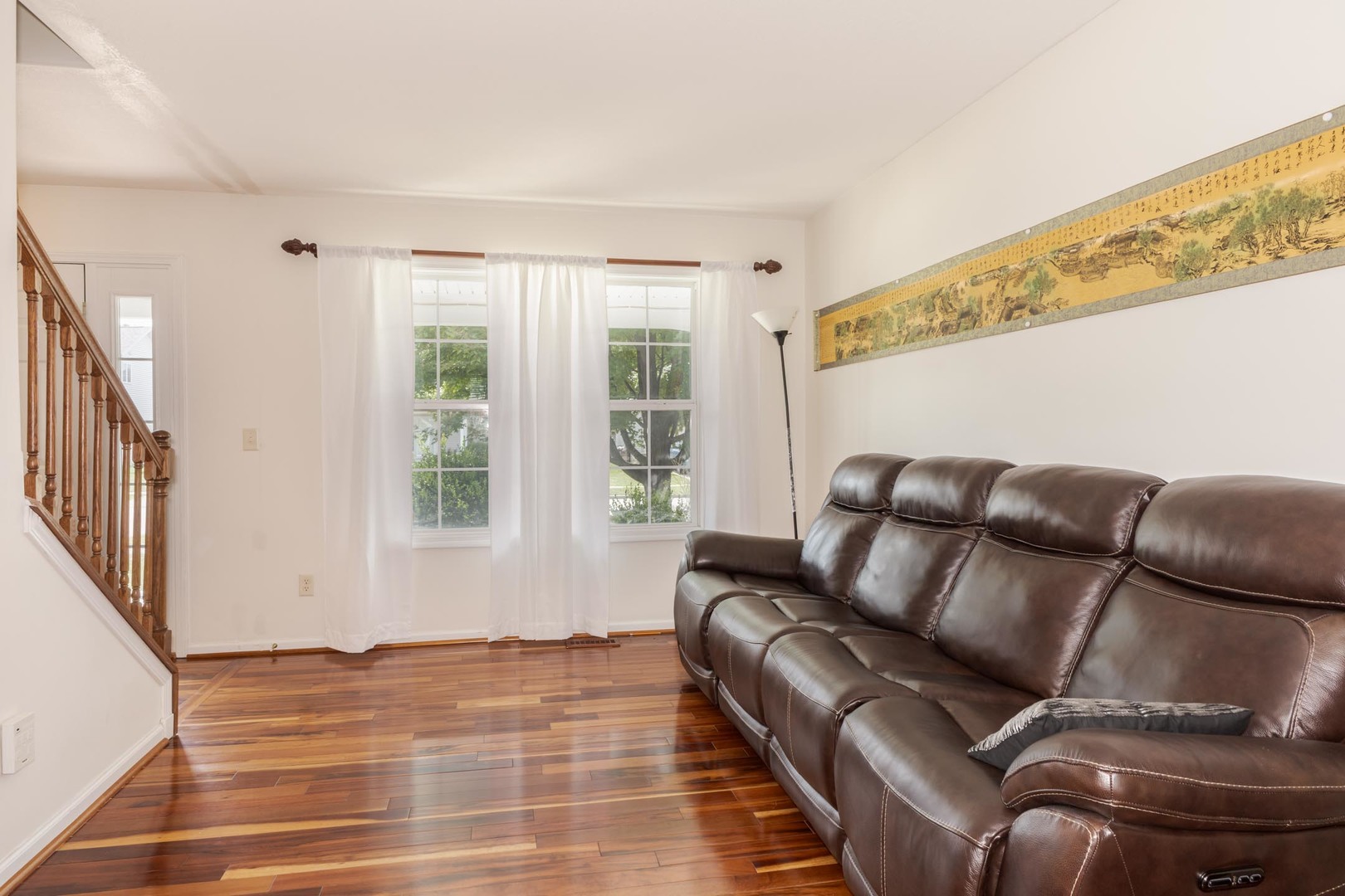 3250 Topaz Road Normal, IL 61761 - Photo 12 of 54 a living room with a couch and a window