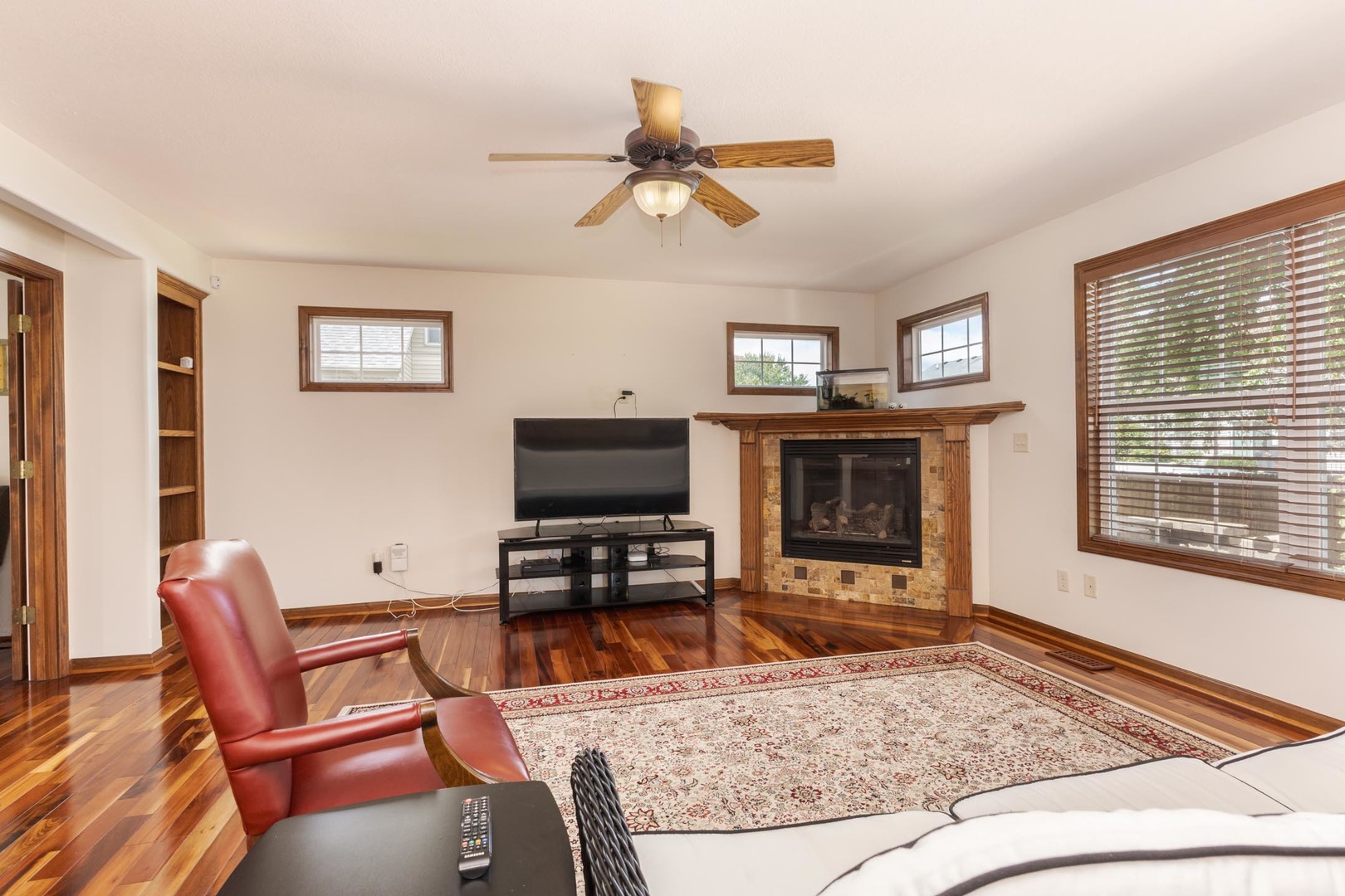 3250 Topaz Road Normal, IL 61761 - Photo 15 of 54 a living room with furniture a flat screen tv and a window