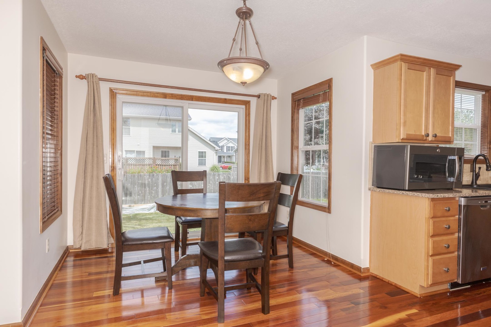 3250 Topaz Road Normal, IL 61761 - Photo 18 of 54 a view of a dining room with furniture window and wooden floor