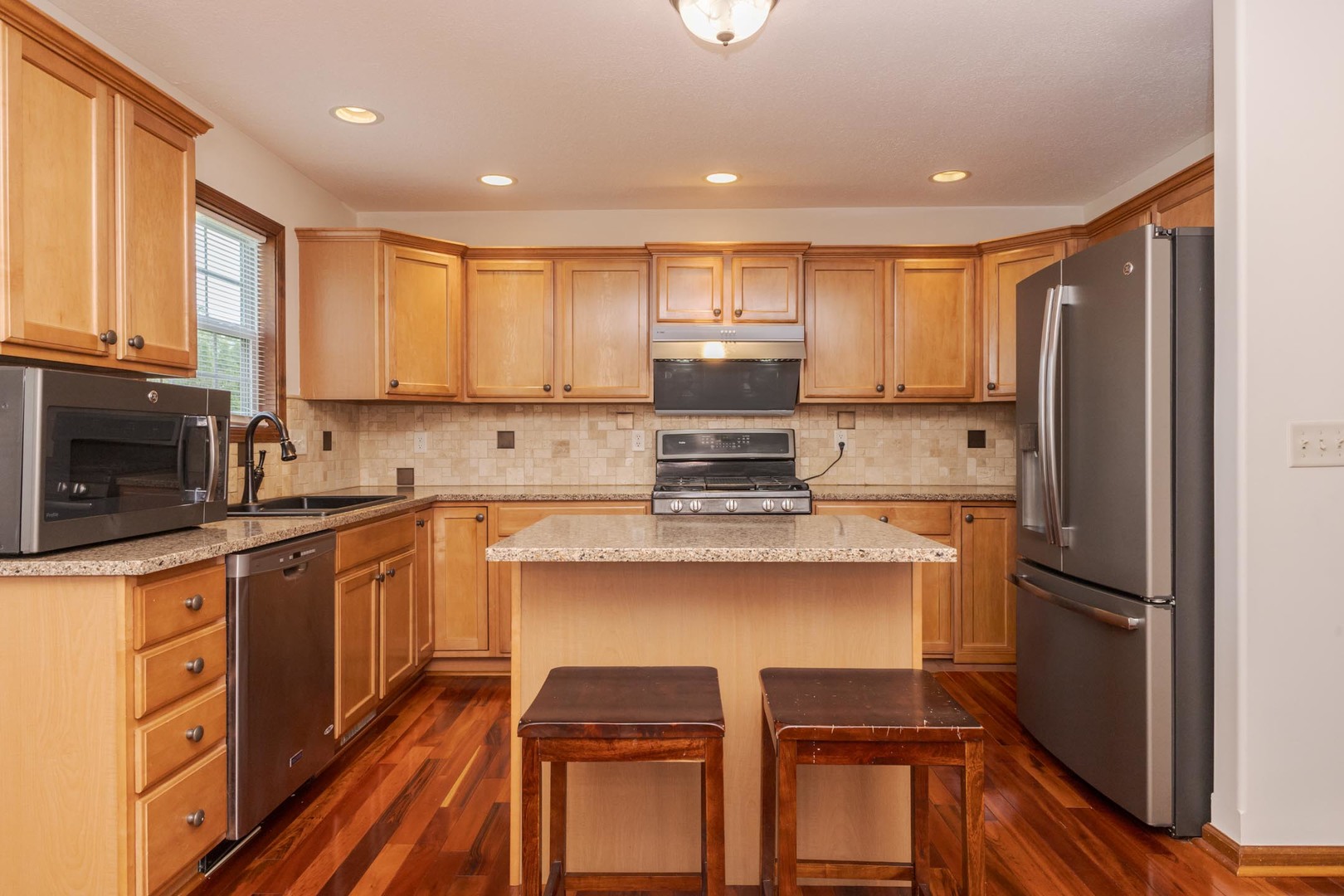 3250 Topaz Road Normal, IL 61761 - Photo 19 of 54 a kitchen with stainless steel appliances granite countertop a refrigerator sink and microwave
