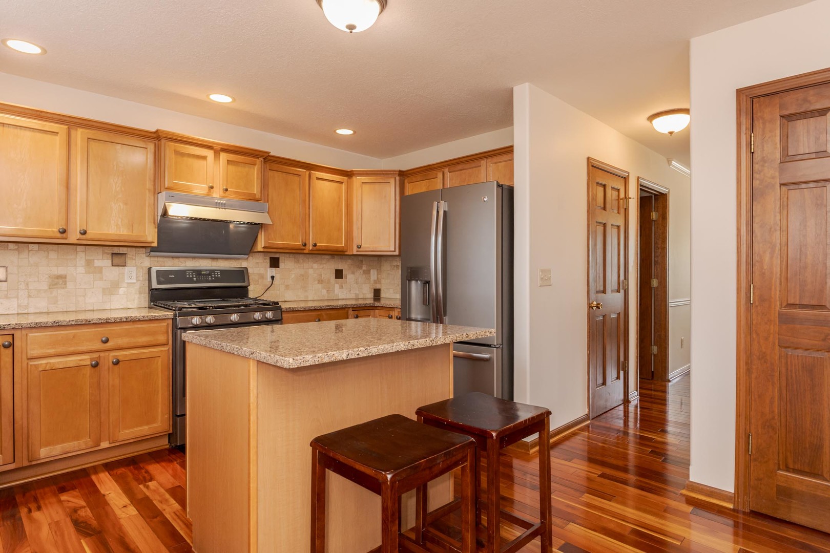3250 Topaz Road Normal, IL 61761 - Photo 22 of 54 a kitchen with stainless steel appliances a stove refrigerator sink and microwave