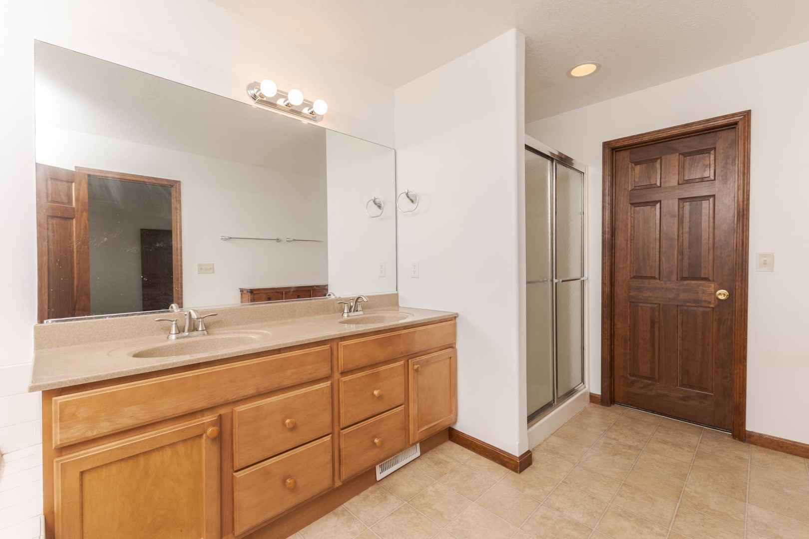 3250 Topaz Road Normal, IL 61761 - Photo 29 of 54 a bathroom with a double vanity sink and mirror