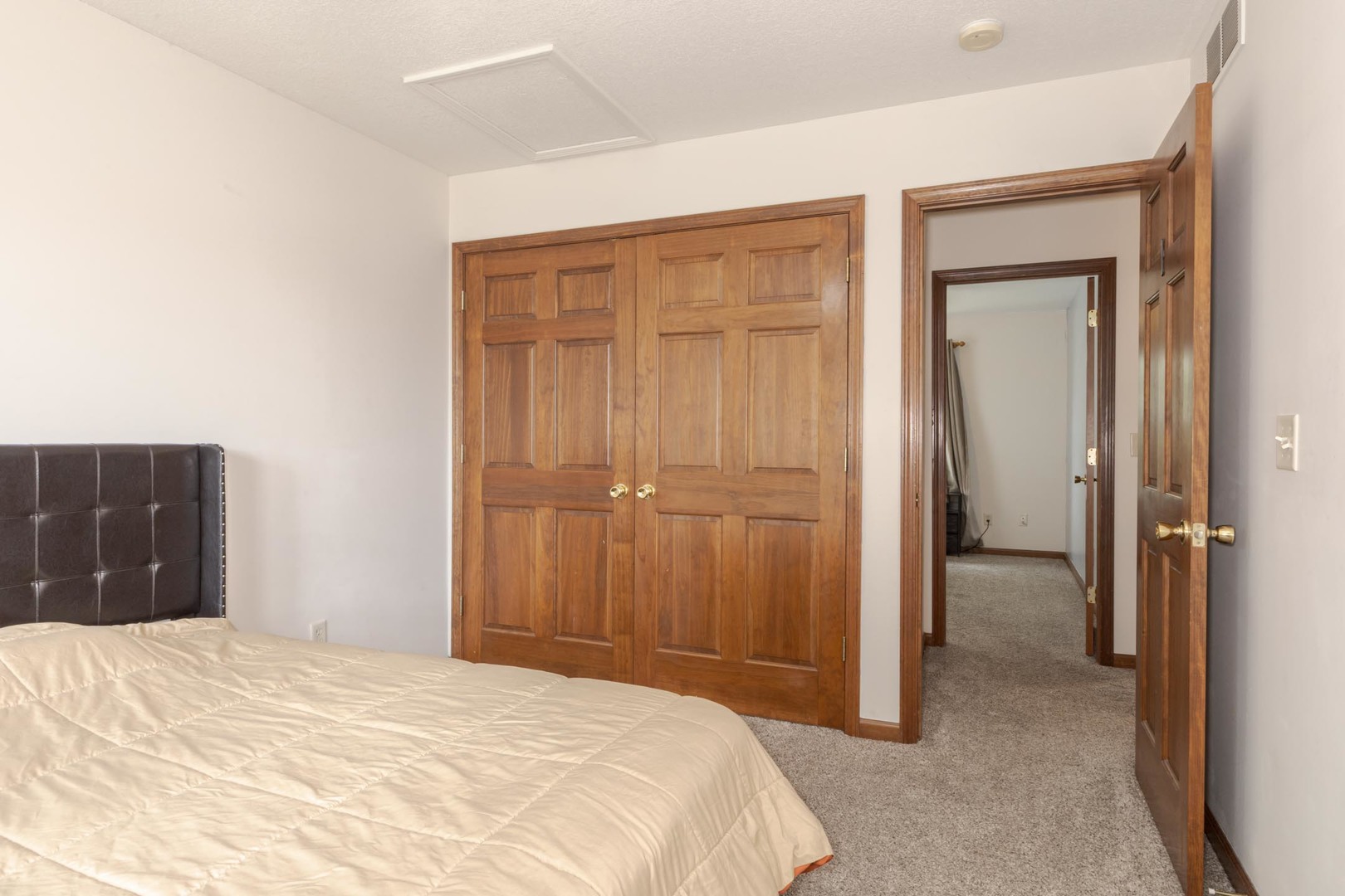 3250 Topaz Road Normal, IL 61761 - Photo 31 of 54 a bedroom with a bed and a mirror