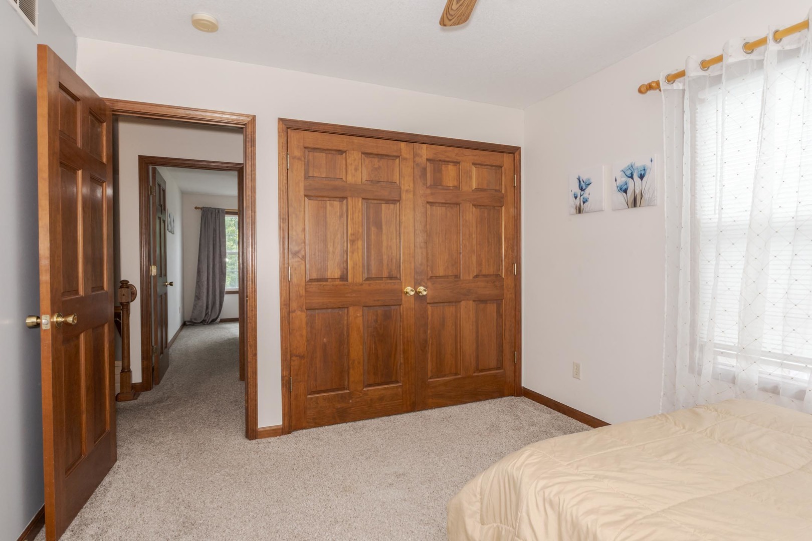 3250 Topaz Road Normal, IL 61761 - Photo 33 of 54 a bedroom with a bed and a chandelier