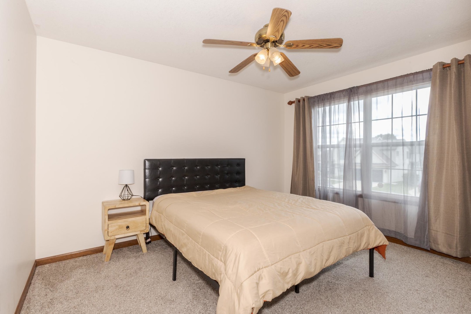 3250 Topaz Road Normal, IL 61761 - Photo 36 of 54 a bedroom with a bed and a large window