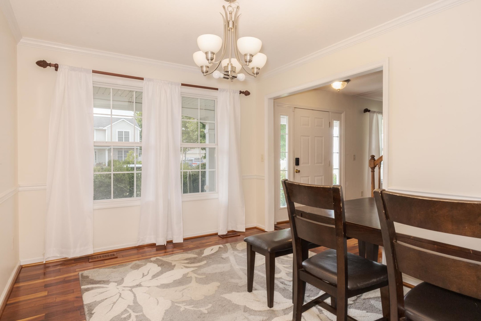 3250 Topaz Road Normal, IL 61761 - Photo 39 of 54 a view of a dining room with furniture and chandelier