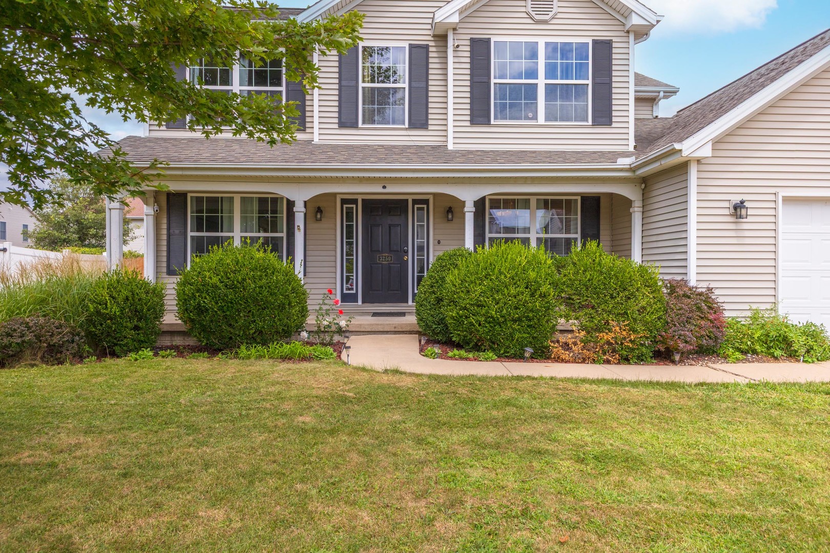 3250 Topaz Road Normal, IL 61761 - Photo 54 of 54 a front view of a house with garden