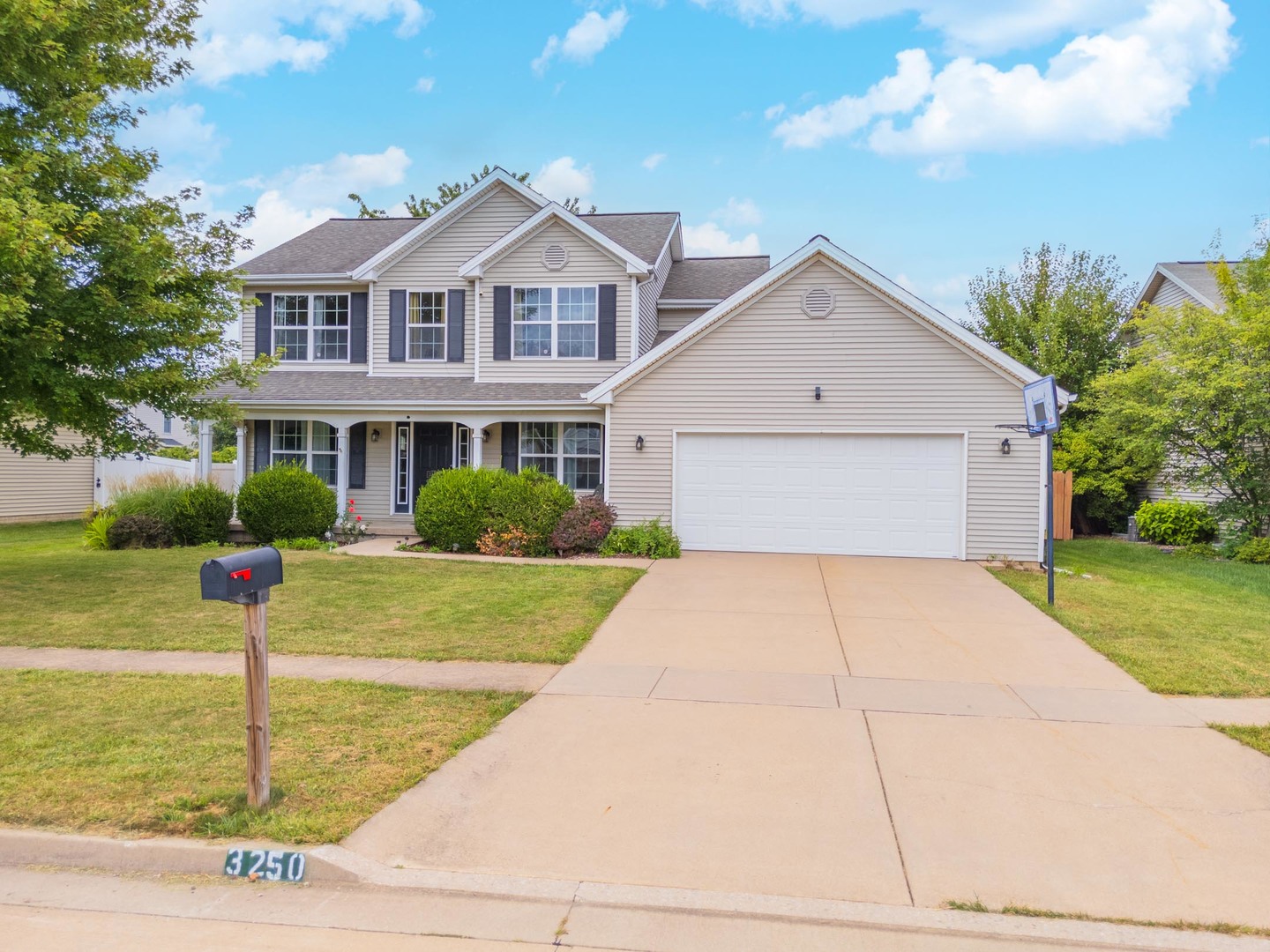 3250 Topaz Road Normal, IL 61761 - Photo 8 of 54 a front view of a house with garden