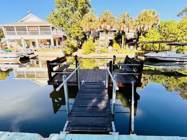 a view of a house with wooden deck
