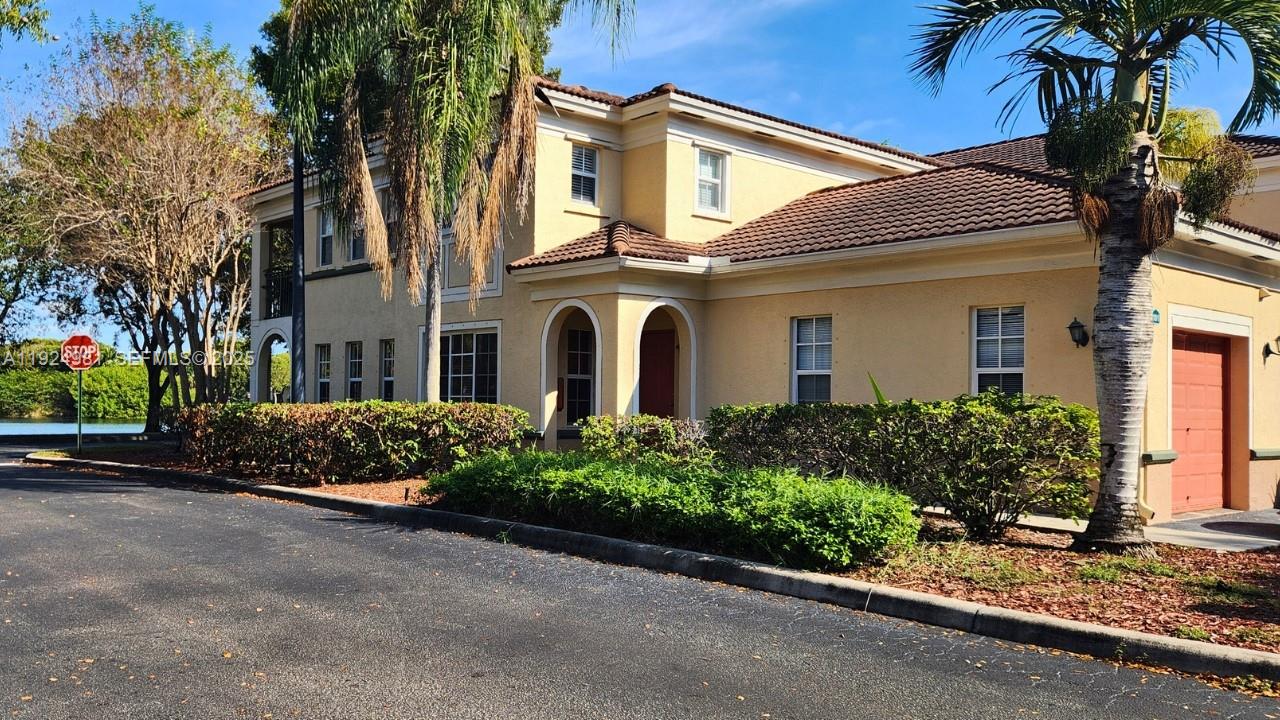 2557 Centergate Drive, Unit 101 Miramar, FL 33025 - Photo 2 of 14 front view of a house
