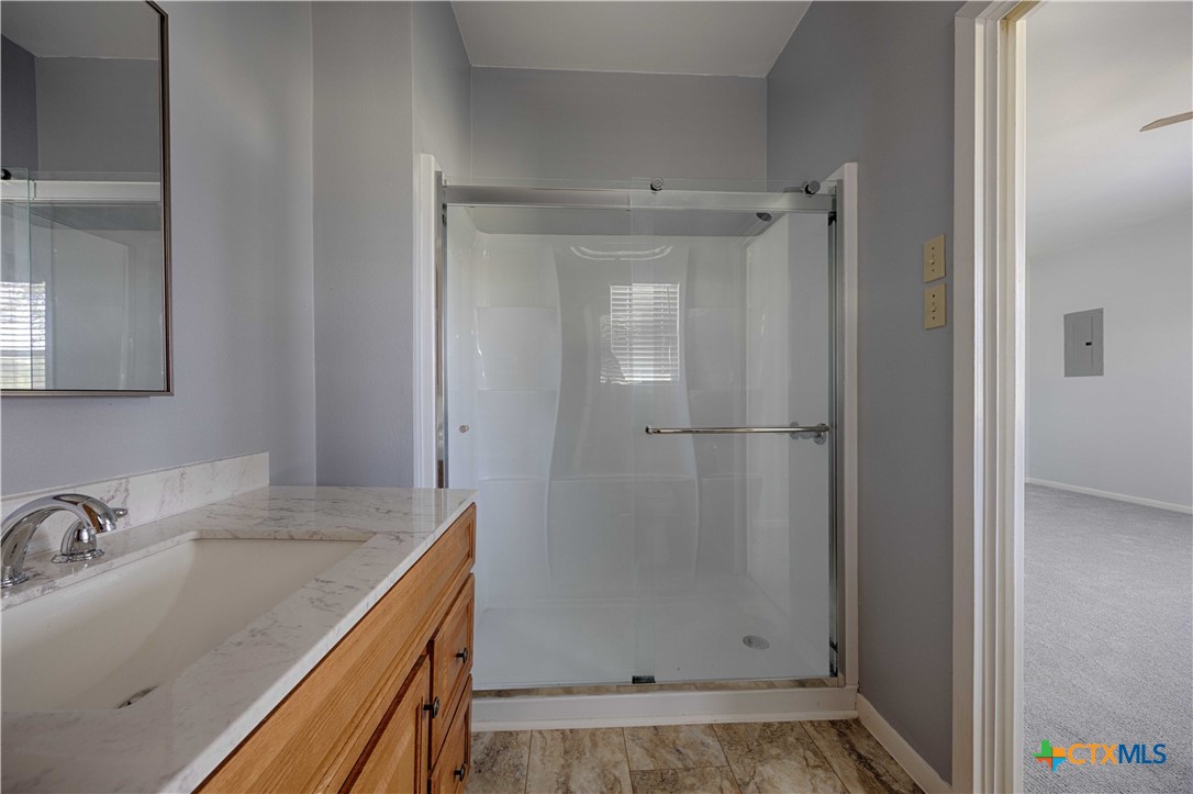 3814 Maeker Road Flatonia, TX 78941 - Photo 12 of 28 a bathroom with a sink and shower