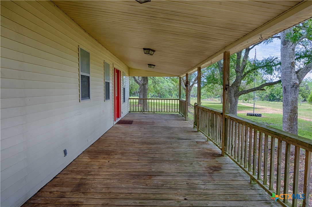 3814 Maeker Road Flatonia, TX 78941 - Photo 21 of 28 a view of a porch with wooden floor and outdoor space