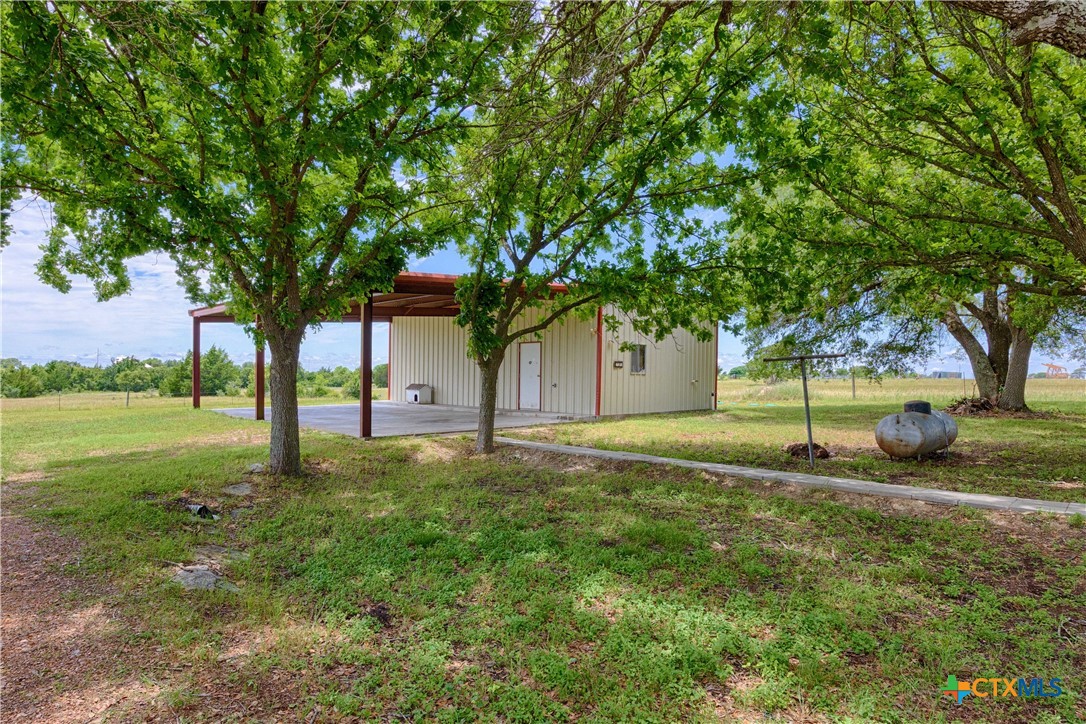 3814 Maeker Road Flatonia, TX 78941 - Photo 24 of 28 a view of backyard with tree