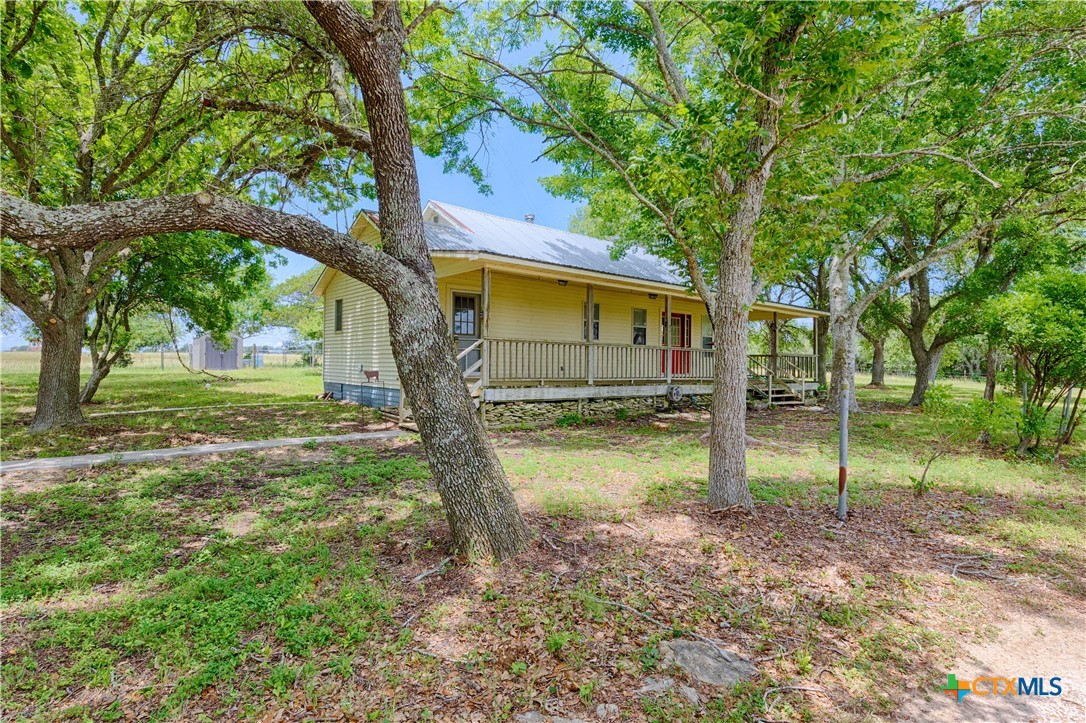 3814 Maeker Road Flatonia, TX 78941 - Photo 25 of 28 a view of a house with a backyard