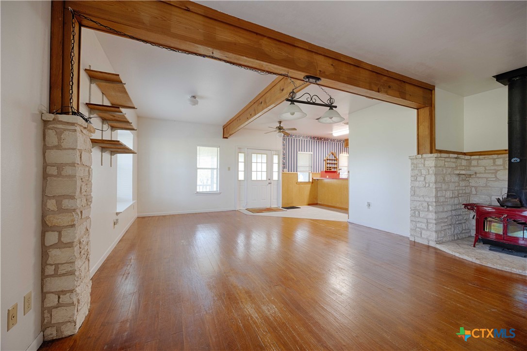 3814 Maeker Road Flatonia, TX 78941 - Photo 8 of 28 a view of empty room with wooden floor and fan
