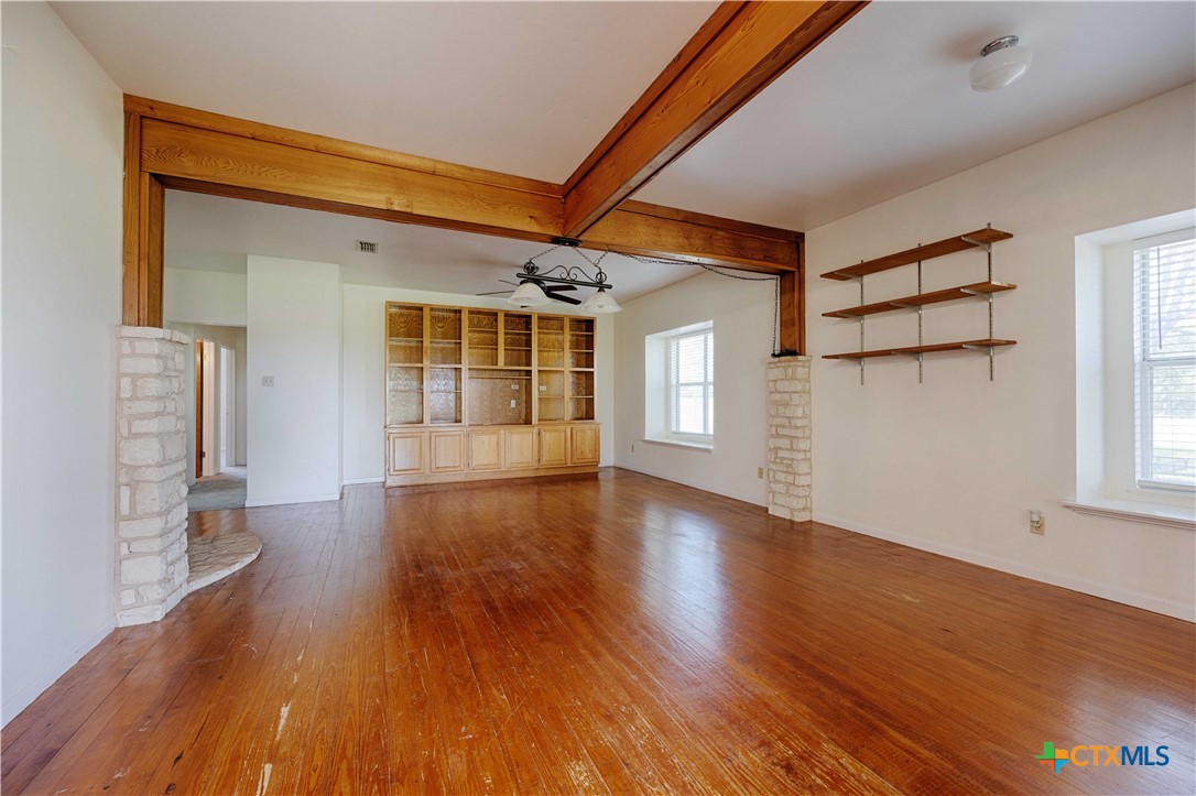 3814 Maeker Road Flatonia, TX 78941 - Photo 9 of 28 a view of livingroom with hardwood floor and window