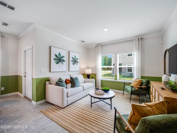 a view of room with furniture and wooden floor