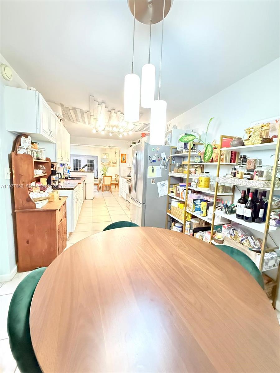 3330 Atlanta Street, Unit 14C Hollywood, FL 33021 - Photo 4 of 15 a view of a kitchen and workspace