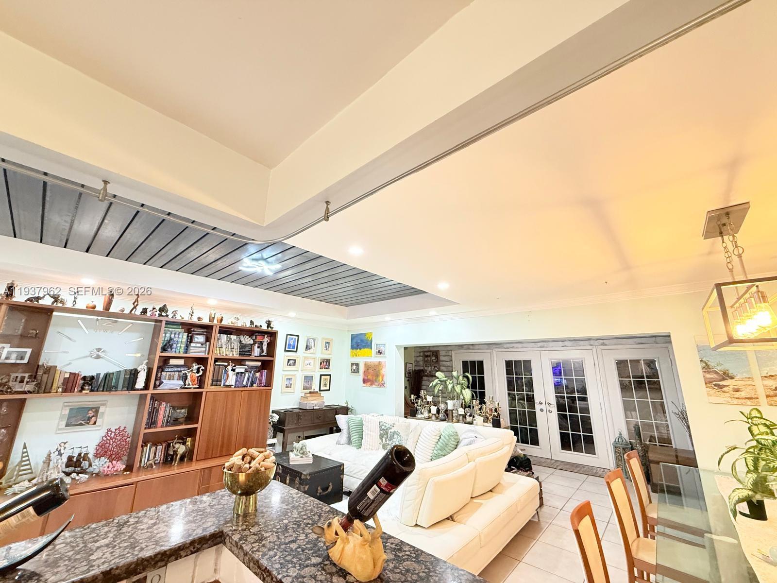 3330 Atlanta Street, Unit 14C Hollywood, FL 33021 - Photo 10 of 15 a living room with furniture a rug and a flat screen tv
