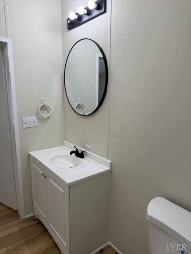 3112 Red House Road Appomattox, VA 24522 - Photo 11 of 14 a bathroom with a sink a toilet and a mirror
