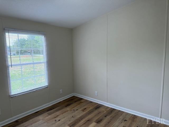 3112 Red House Road Appomattox, VA 24522 - Photo 14 of 14 an empty room with wooden floor and windows