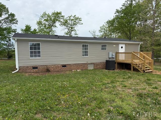 3112 Red House Road Appomattox, VA 24522 - Photo 3 of 14 a backyard of a house with barbeque oven and outdoor seating