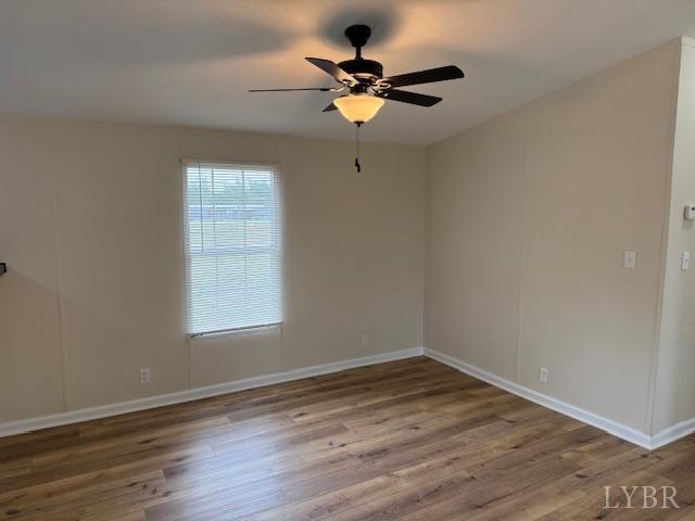 3112 Red House Road Appomattox, VA 24522 - Photo 5 of 14 wooden floor in an empty room with a window