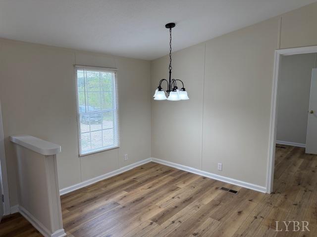 3112 Red House Road Appomattox, VA 24522 - Photo 6 of 14 a view of empty room with wooden floor and window