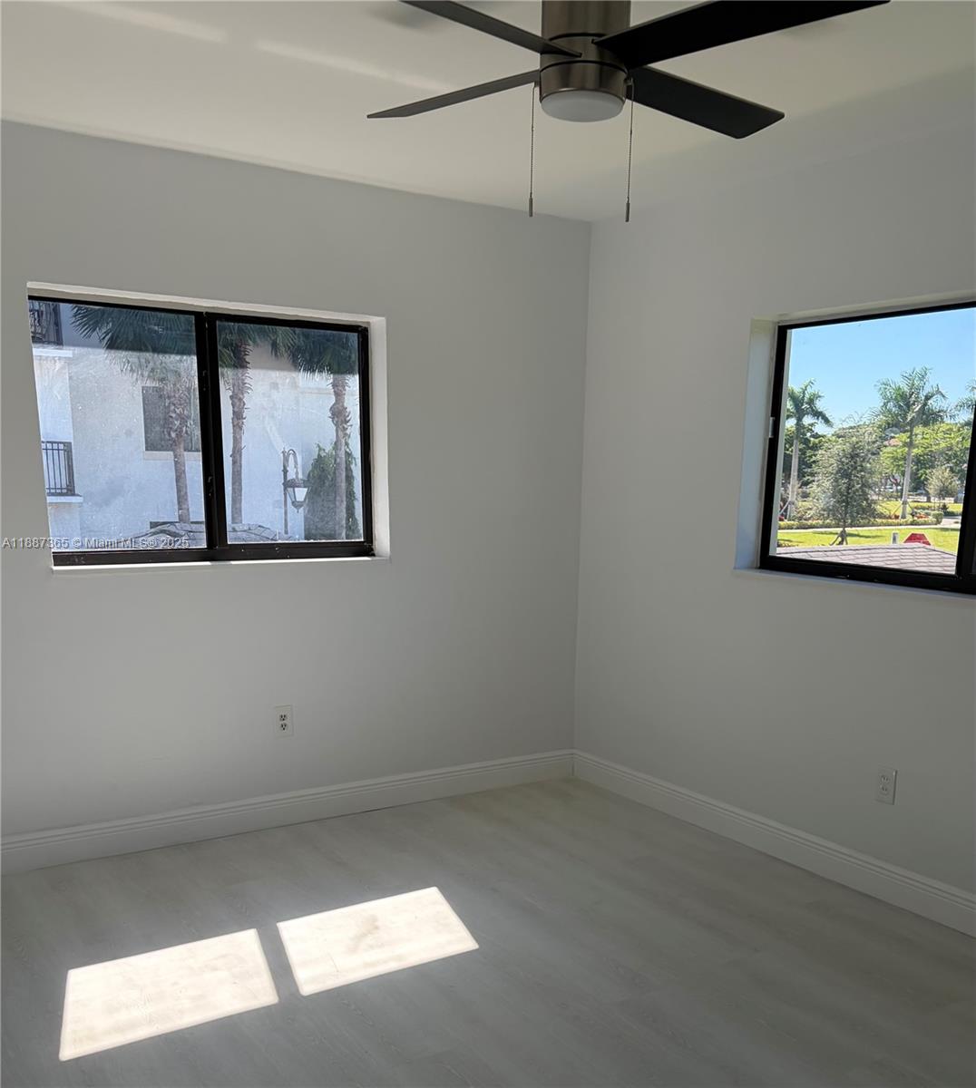 220 Southwest 7th Street, Unit 8 Boca Raton, FL 33432 - Photo 11 of 14 a view of room with window and ceiling fan