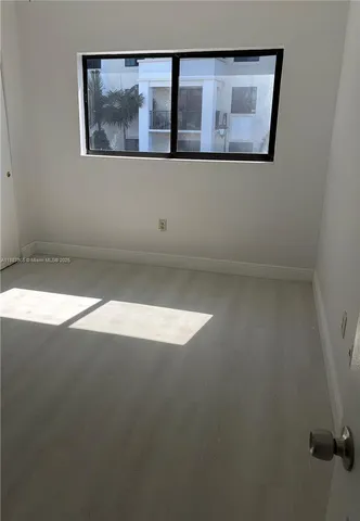a view of wooden floor and entryway