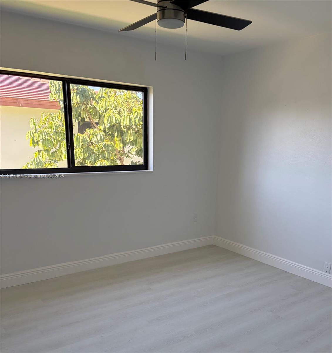 220 Southwest 7th Street, Unit 8 Boca Raton, FL 33432 - Photo 10 of 14 en empty room with a window