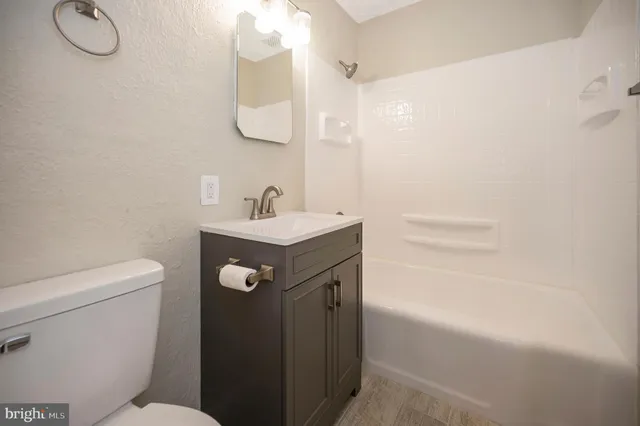 a view of entryway with wooden floor and stairs