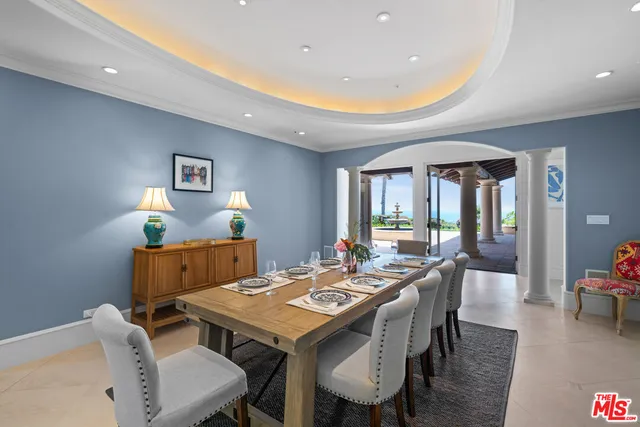 a room with pool table and windows