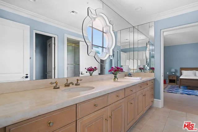 a bedroom with a bed and ceiling fan