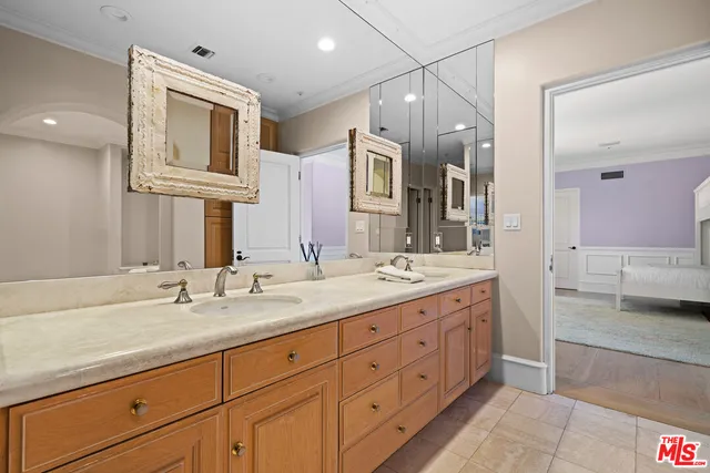 a bedroom with a bed and a fireplace