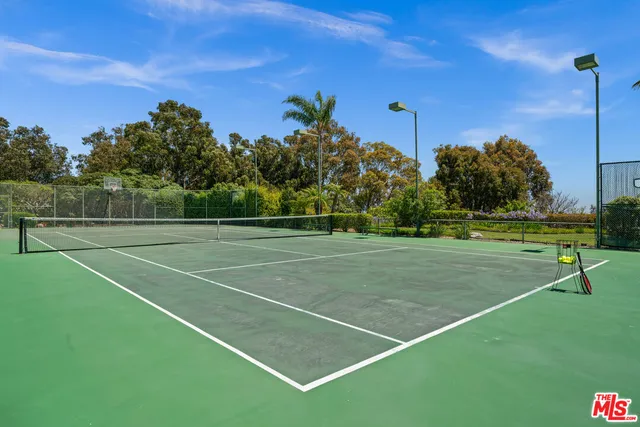 a swimming pool with outdoor seating