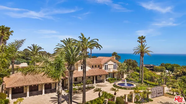 a view of an chairs and table in patio