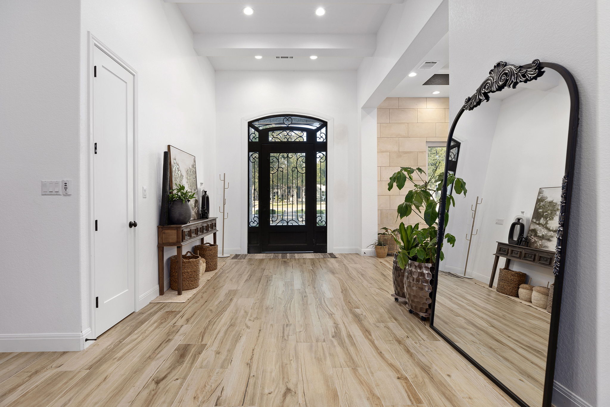 153 Fawn Hollow Elgin, TX 78621 - Photo 6 of 40 wooden floor in an empty room with a mirror