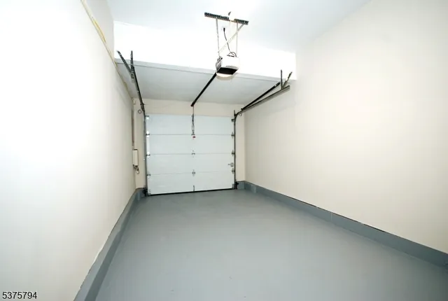 a view of a room with rack and white walls