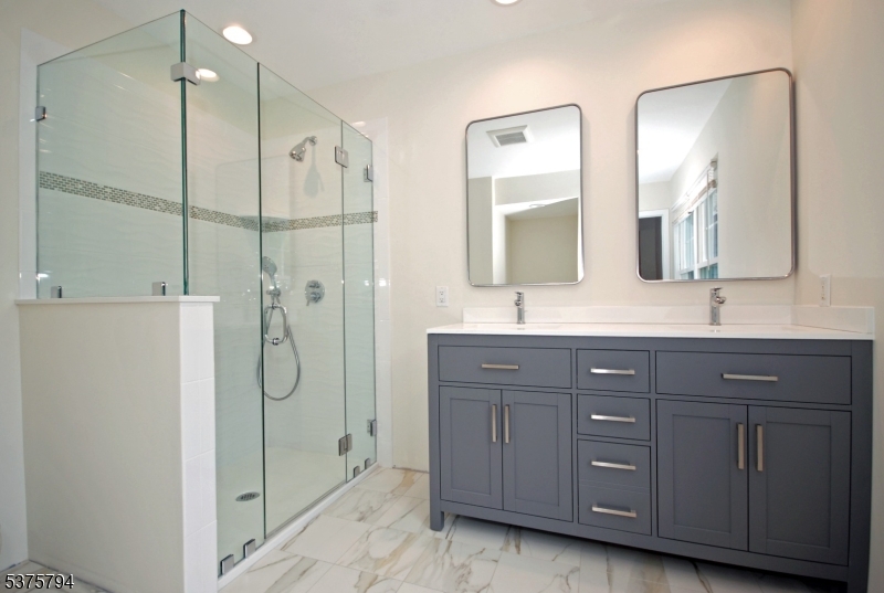 23 Buffalo Hollow Road Somerville, NJ 08876 - Photo 8 of 12 a bathroom with a double vanity sink mirror and double