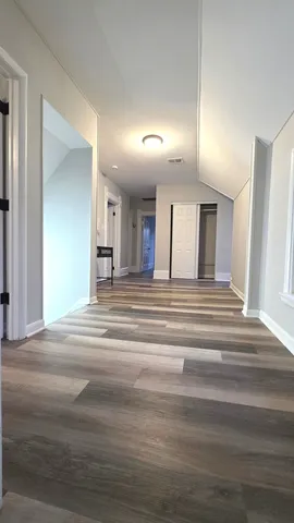 a view of a hallway view with staircase