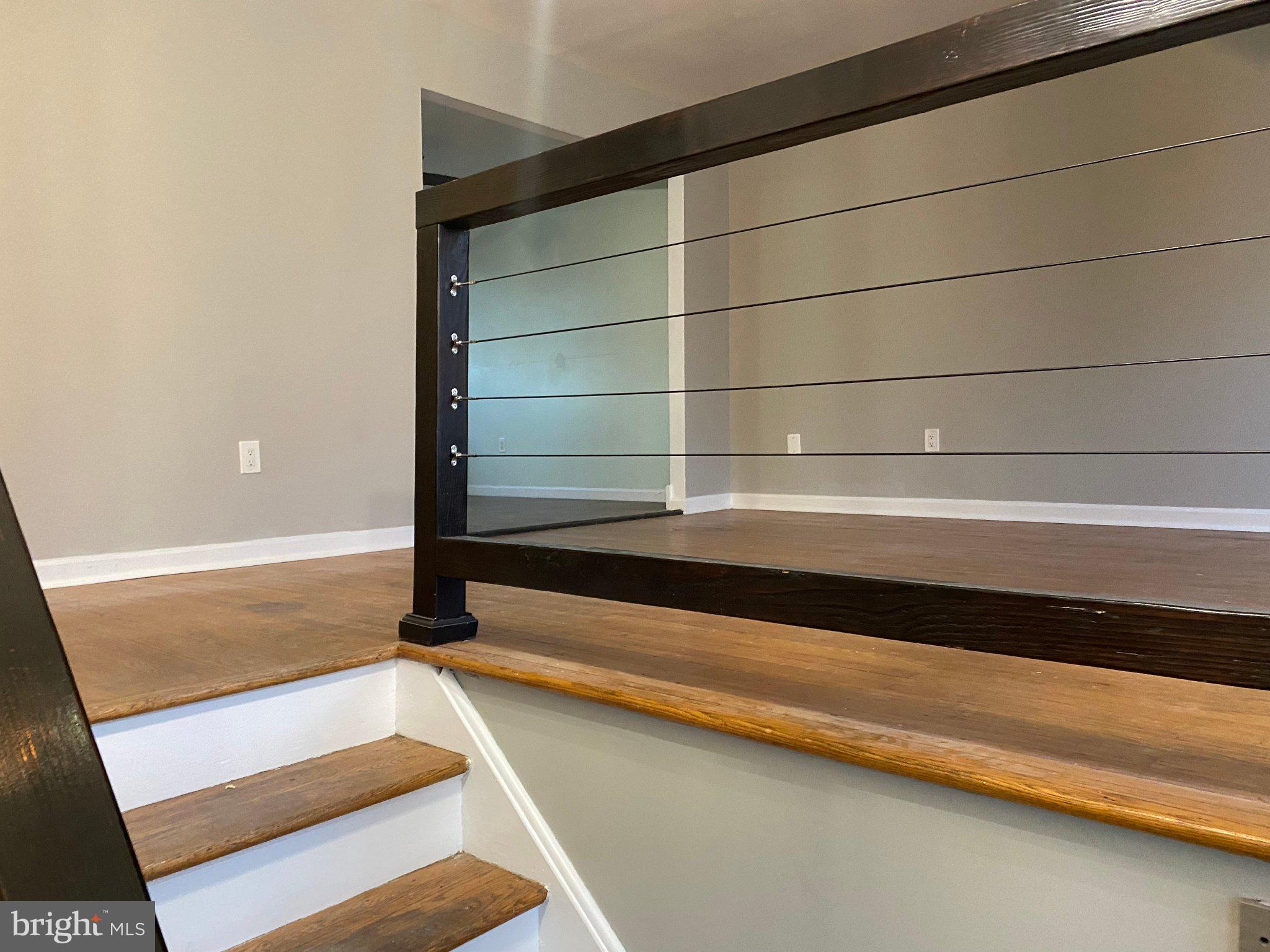 106 Parkview Road Stratford, NJ 08084 - Photo 6 of 27 Modern staircase with sleek railing.